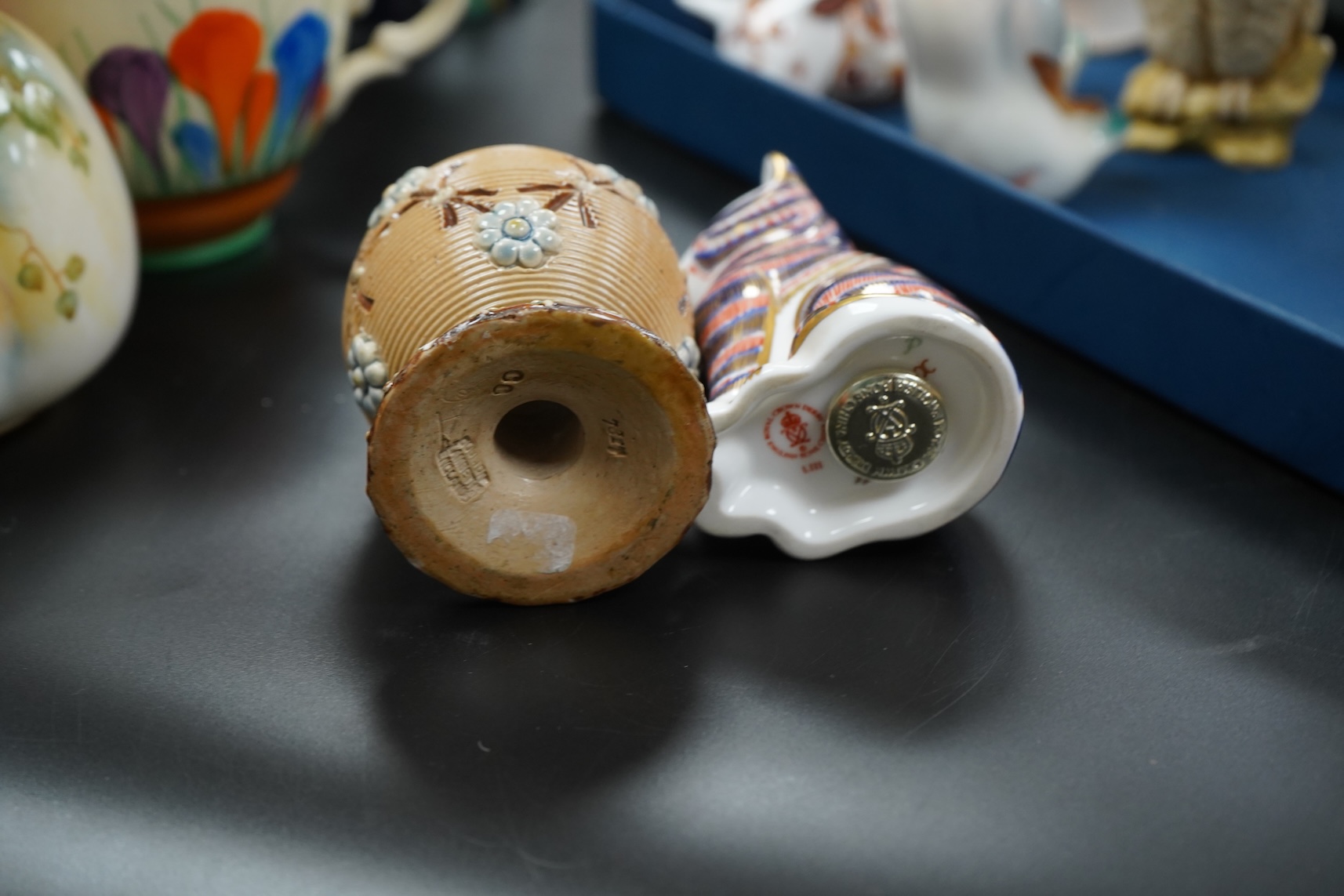 A collection of mixed porcelain and pottery to include four Worcester vases, one signed H. Blake, Clarice Cliff crocus pattern cup, saucer and sugar bowl and two Doulton Imari paperweights, largest 13cm high